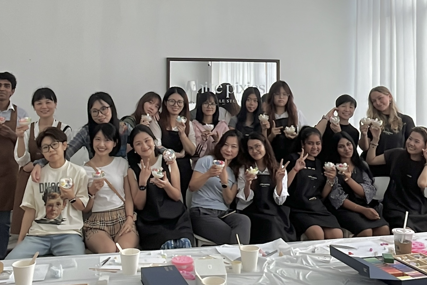 Pouring a custom scented candle at a White Pixies workshop