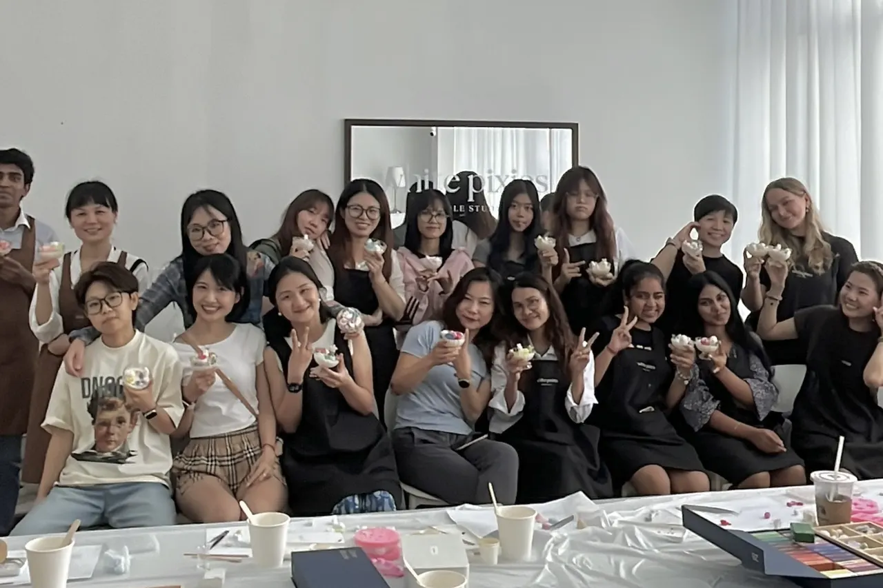 Pouring a custom scented candle at a White Pixies workshop