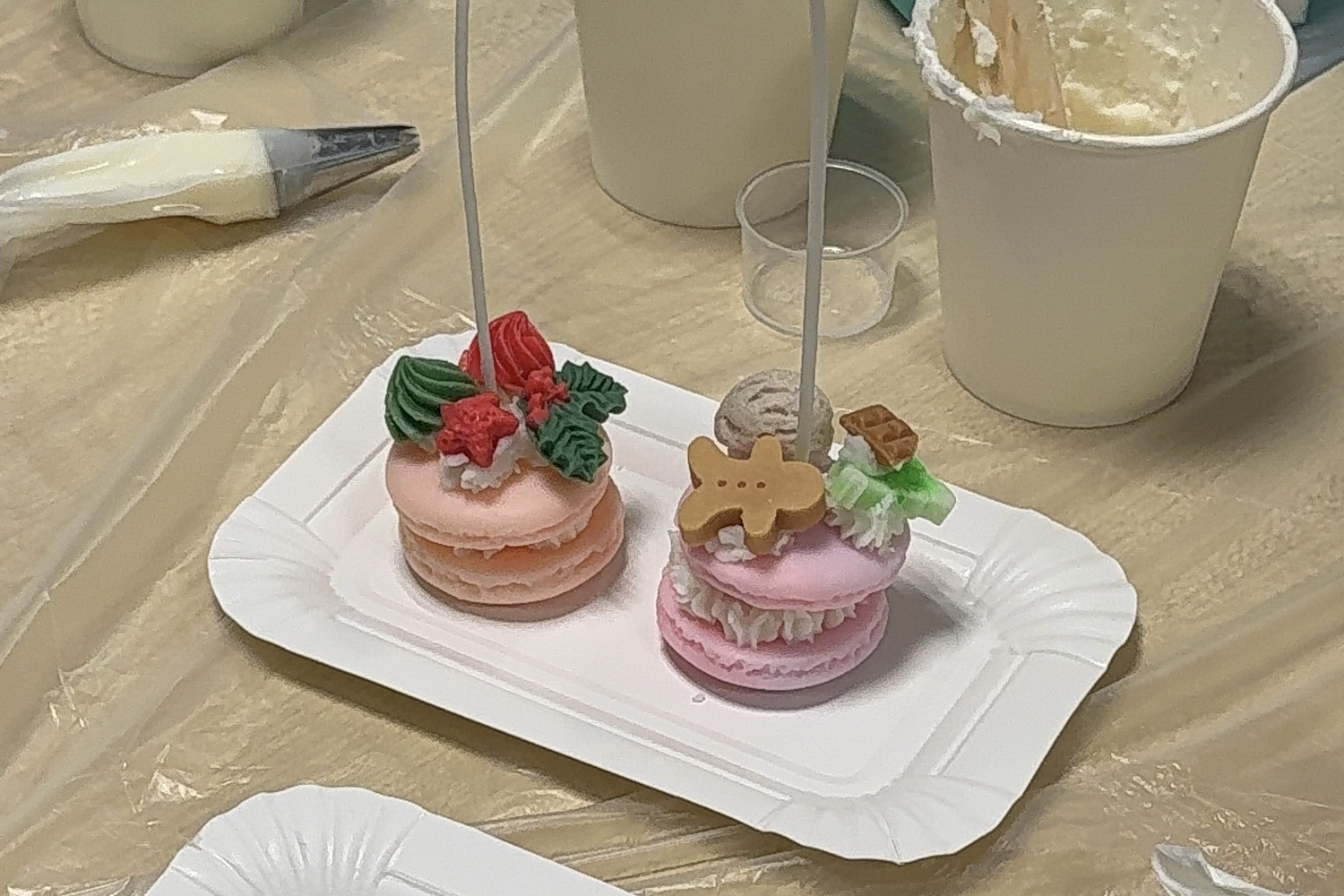 Piping cream wax into macaron candles
